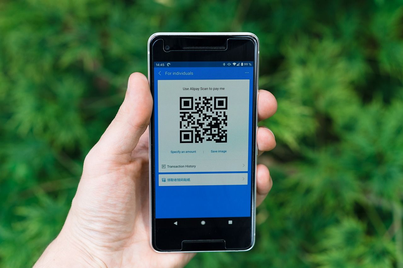 A mobile-payment QR code displayed at a shop counter in China — the newest route for tax-refund payout
