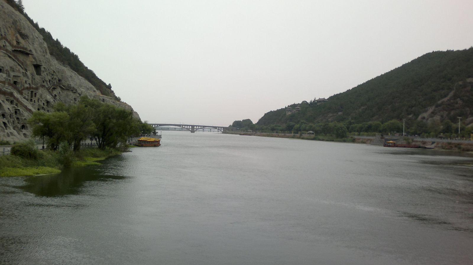 The Longmen Grottoes carved into the cliff above the Yi River