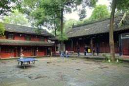 Residents playing ping-pong in the courtyard of Wenshu Monastery, Chengdu, a traditional courtyard with timber buildings