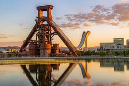 Sunset view of Shougang Park in Beijing, blast furnaces and the Big Air ski jump against the evening sky