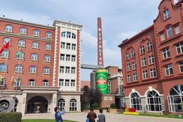Red-brick Tsingtao Brewery Museum complex in Qingdao with the TSINGTAO chimney and giant beer-can display