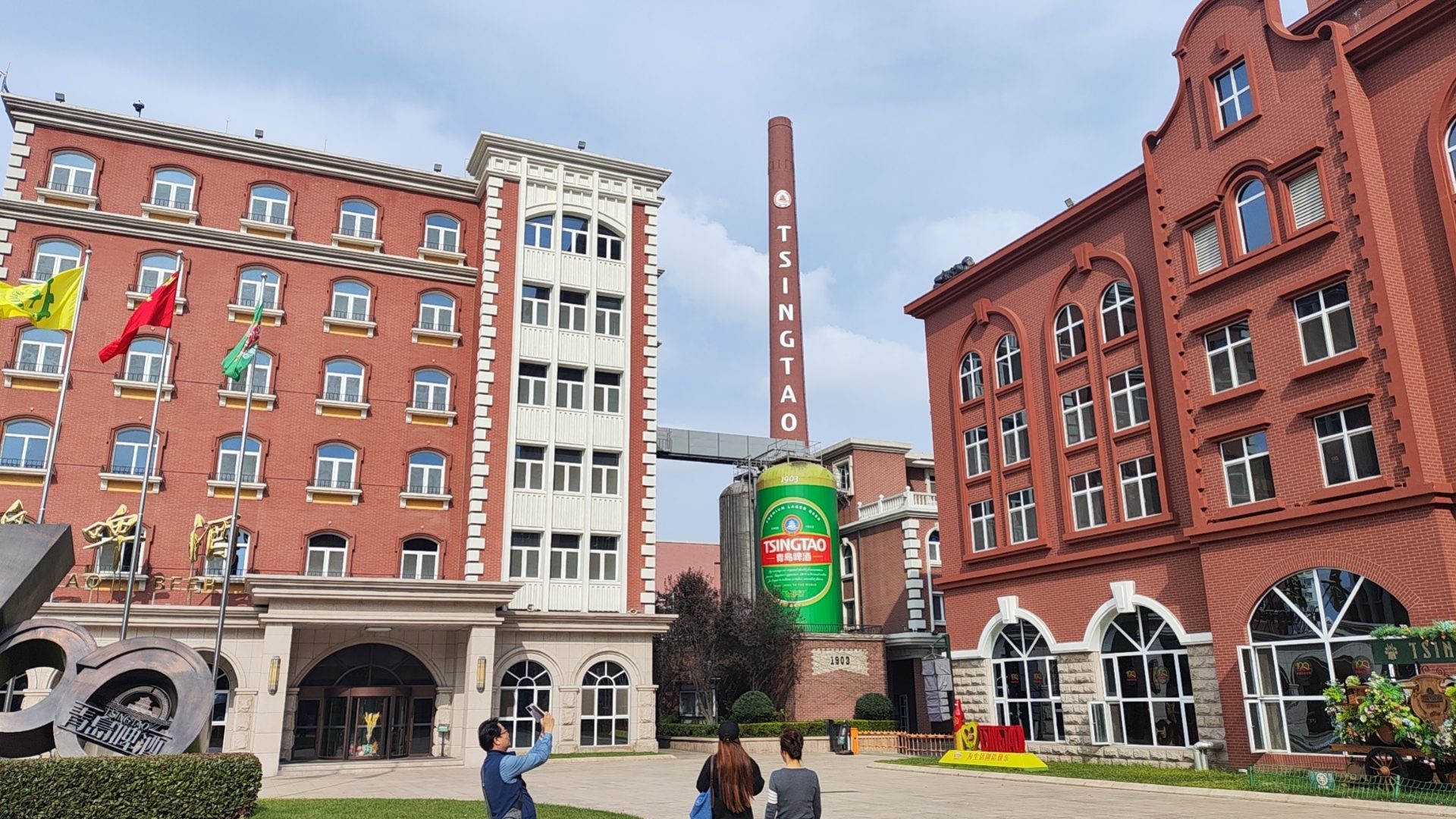 Red-brick Tsingtao Brewery Museum complex in Qingdao with the TSINGTAO chimney and giant beer-can display